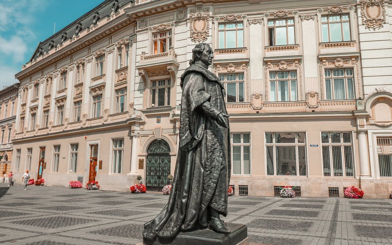 image source Photo by Deborah Seychell: https://www.pexels.com/photo/statue-in-the-primaria-sibiu-square-in-transylvania-romania-13760434/