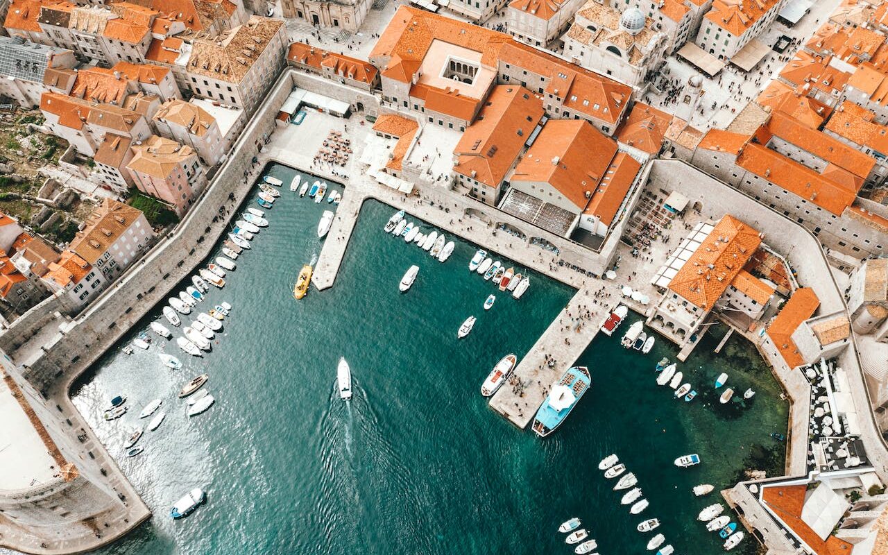 image source Photo by Spencer Davis: https://www.pexels.com/photo/old-city-port-with-moored-ships-and-historical-houses-4353632/