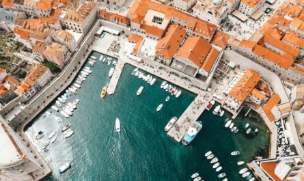 image source Photo by Spencer Davis: https://www.pexels.com/photo/old-city-port-with-moored-ships-and-historical-houses-4353632/