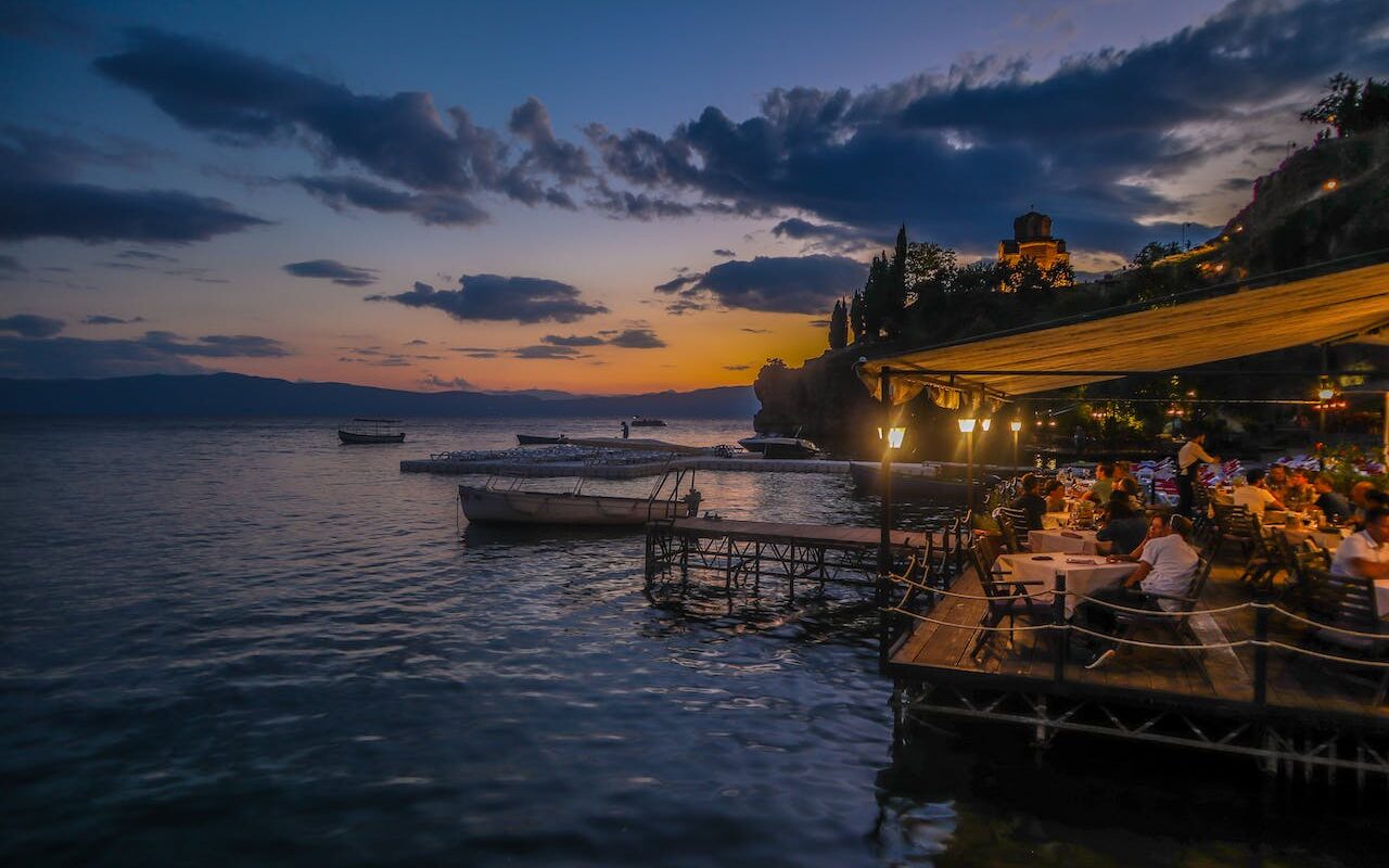 image source Photo by Ljupco Dzambazovski: https://www.pexels.com/photo/people-in-a-restaurant-beside-body-of-water-1346132/