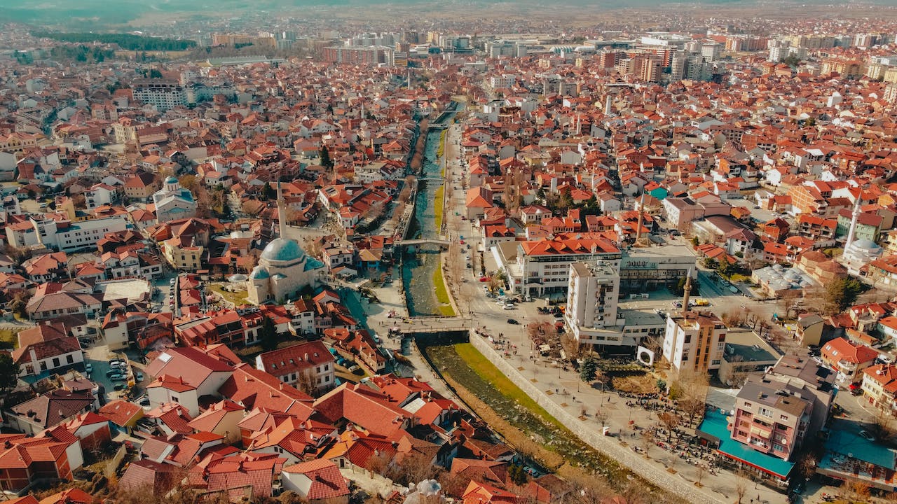 image source Photo by Şenad Kahraman: https://www.pexels.com/photo/drone-shot-of-a-river-surrounded-by-houses-and-buildings-in-a-city-11287101/